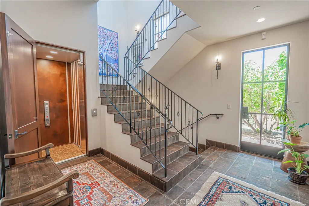 Enjoy the convenience of elevator access from the garage to both the first and second floors, along with a beautifully designed additional staircase for ease and flexibility.
