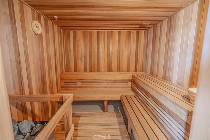 Extend your wellness routine with the expansive dry sauna, accommodating over 8 people.