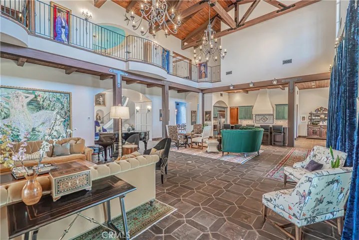 Imported Spanish tiles flow throughout the home, while custom designer wrought iron railings on the upper landing create a striking focal point and enhance the open-concept design between the first and second floors.