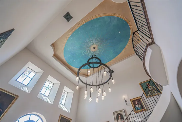 
Look up in the grand entry to admire a breathtaking mural inspired by the throne room of Neuschwanstein Castle in Bavaria.