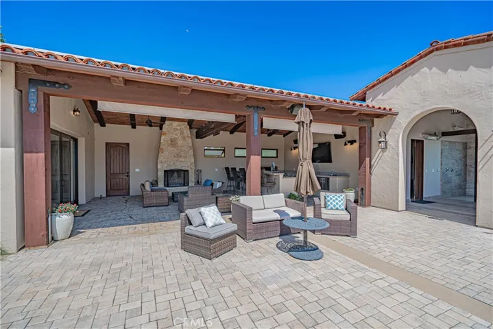 The pool house entertaining area is truly one of a kind, equipped with everything you need to enjoy the outdoors or catch your favorite sports games in comfort.