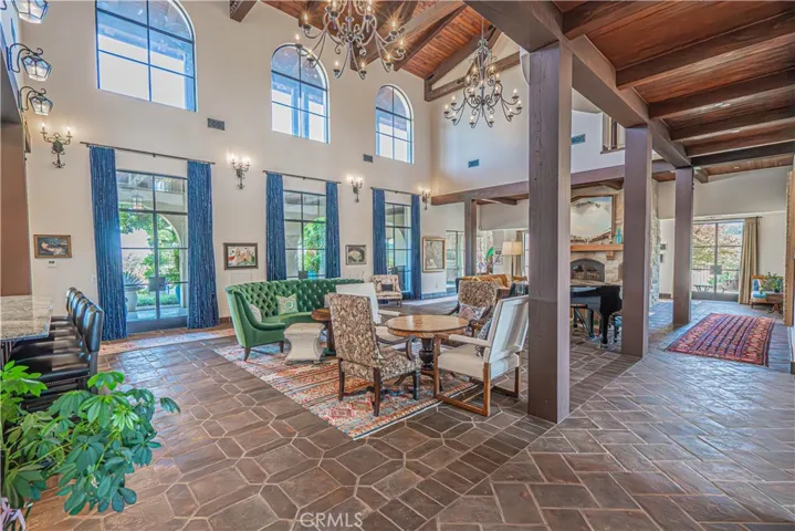 An exquisite living area featuring French doors that open seamlessly to the stunning outdoor space.
