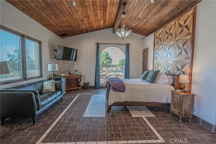 The guest room features an ensuite, abundant natural light, and convenient access to the beautiful pool area —   situated separately from the main house to ensure privacy.