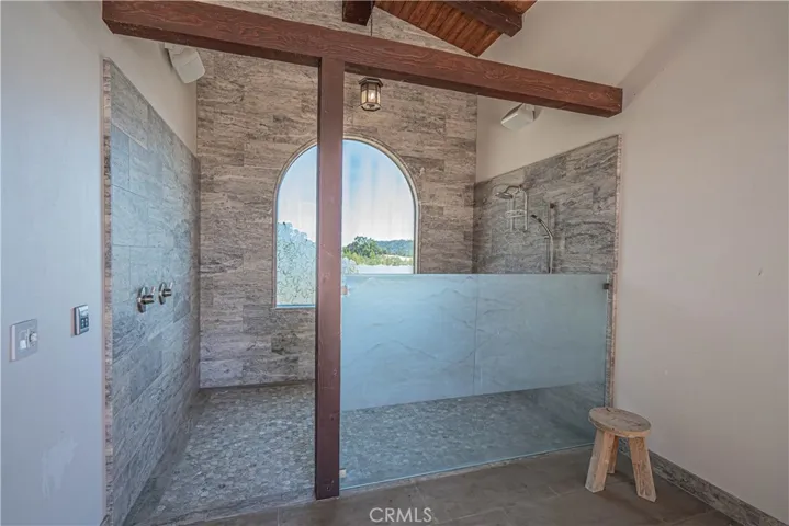 Oversized outdoor shower provides convenient and accessible rinsing after pool time, sauna, steam room, or workout sessions.