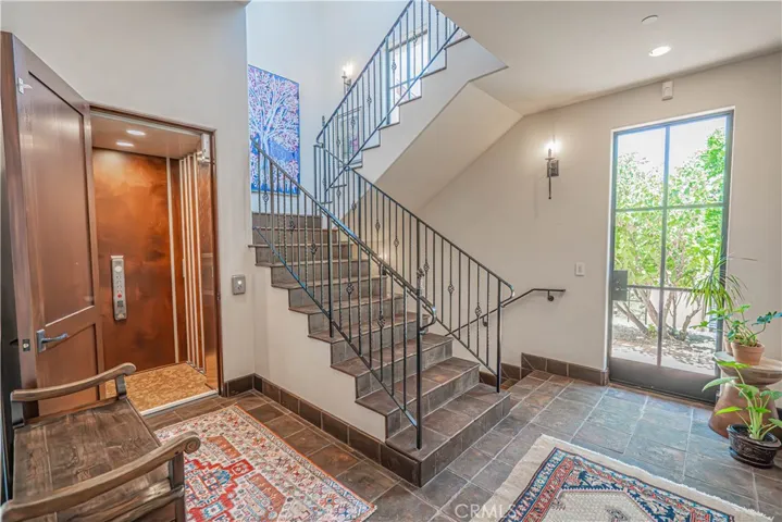Enjoy the convenience of elevator access from the garage to both the first and second floors, along with a beautifully designed additional staircase for ease and flexibility.