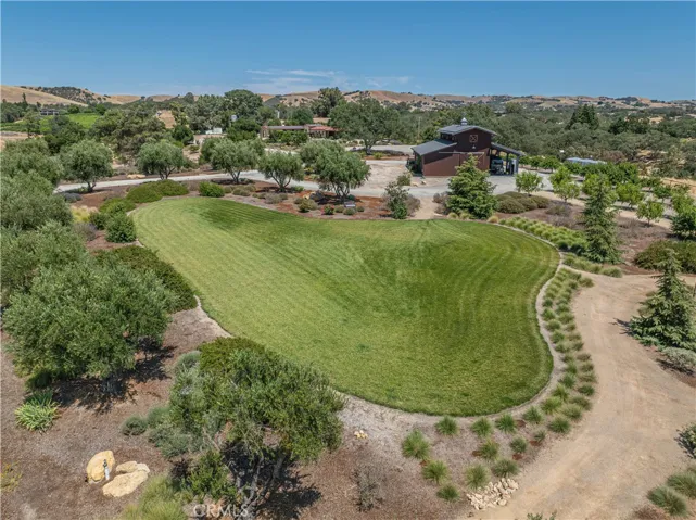 Another perspective showcasing the stunning native landscaping and the generous distance between the structures.
