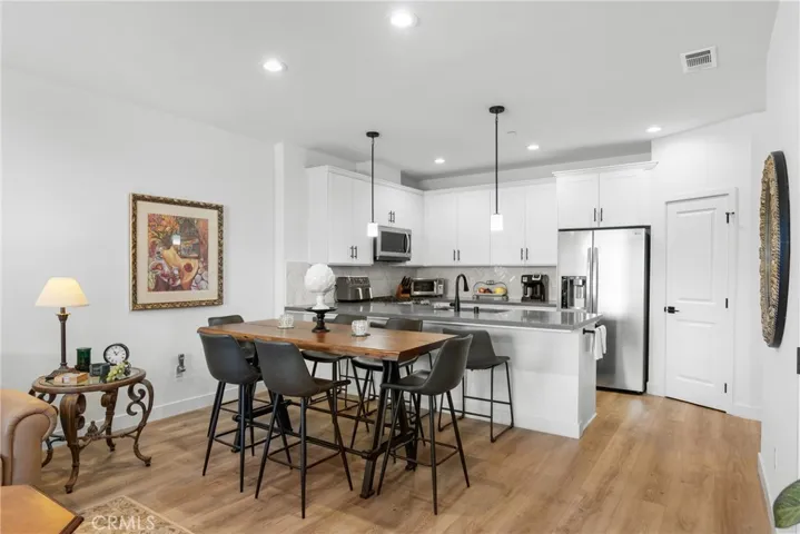 Dining Area & Kitchen In Background