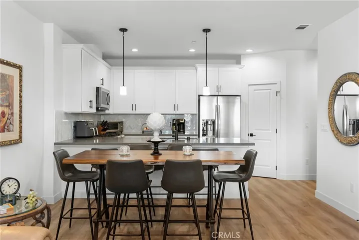 Dining Area & Kitchen In Background