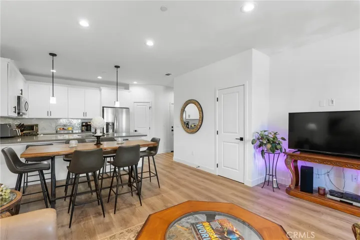 Living Room & Kitchen In Background