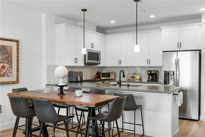 Dining Area & Kitchen In Background