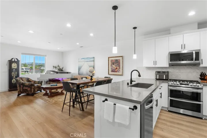 Kitchen & Living Room In Background