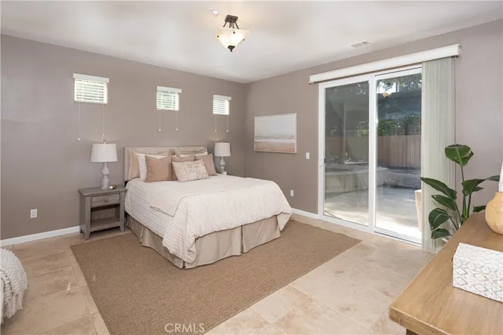 The sliding glass doors lead to the Koi Pond outside.