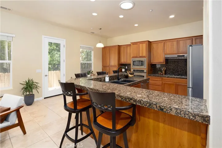 The large kitchen counter with matching chairs that will remain with the new owners.