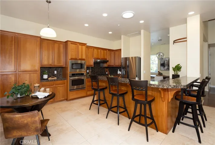 Plenty of cupboard space in this kitchen for entertaining guests.