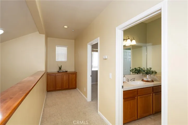 Upstairs hallway with cabinets