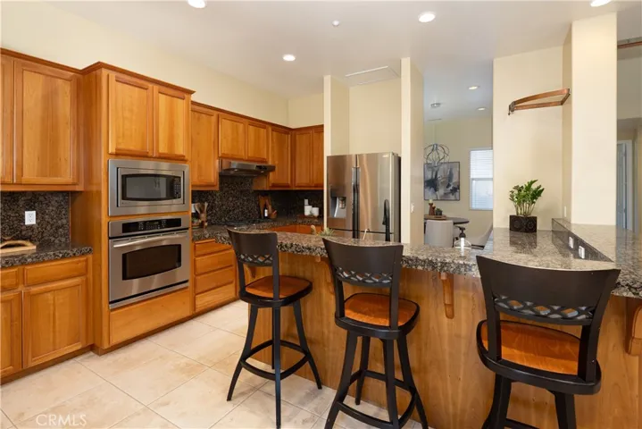 On the other side of the countertop is the Bosch dishwasher and sink.