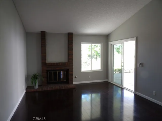 Livingroom, fireplace and Sliders going out to the private patio. YES, forever views.