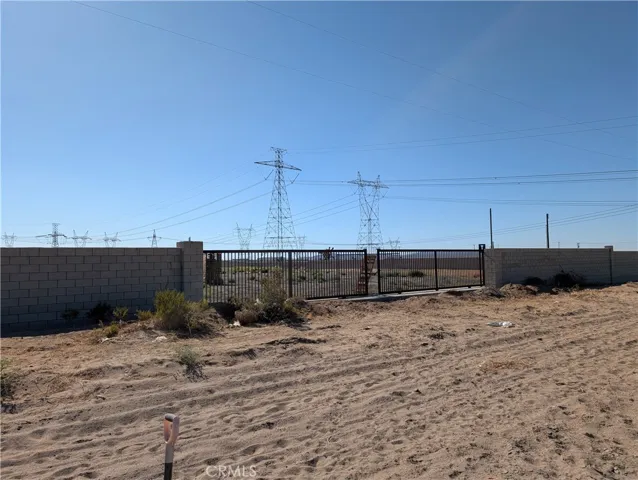 view of gates to the Industrial business to the west