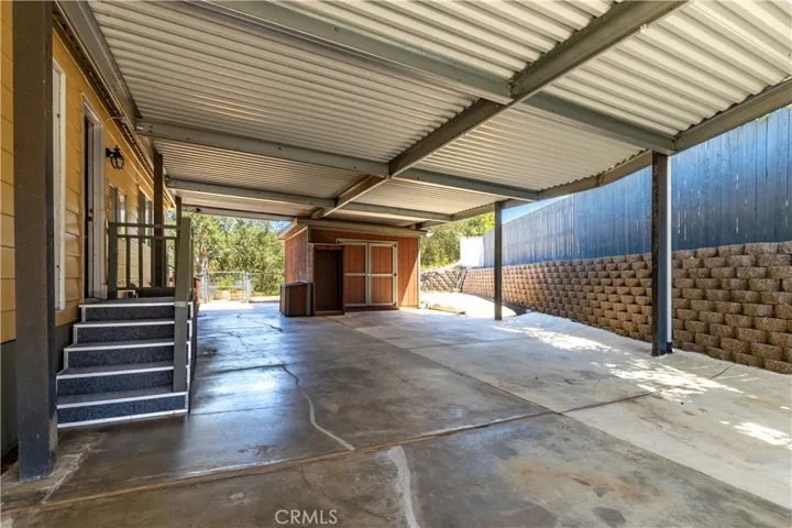 Owner says carport is ~1300dsqft. Bring your toys!