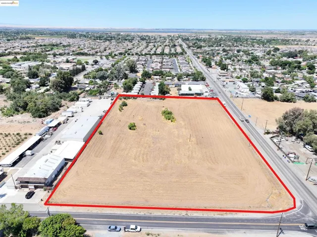 Aerial overview of property's location featuring property parcel outlined