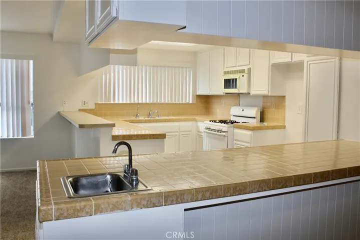 Bright open kitchen with lots of cabinets and counter space