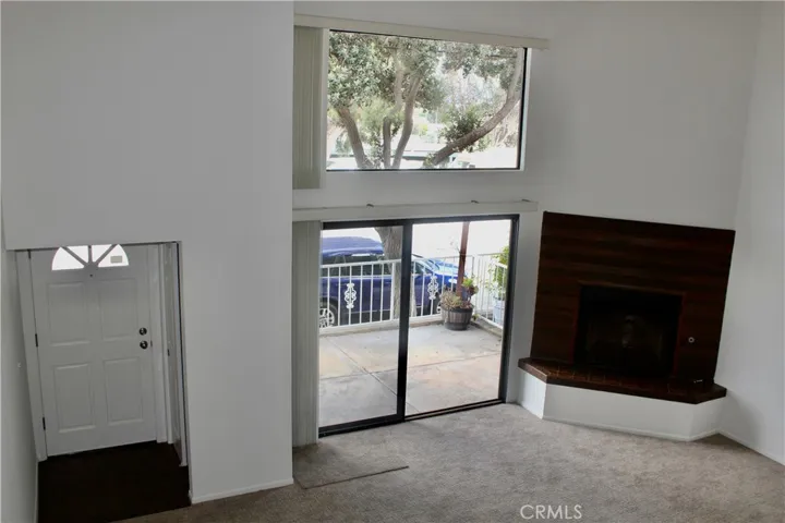 Entry to living room with soaring ceilings
