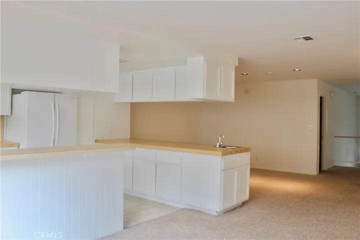 Kitchen opens to family room and dining area