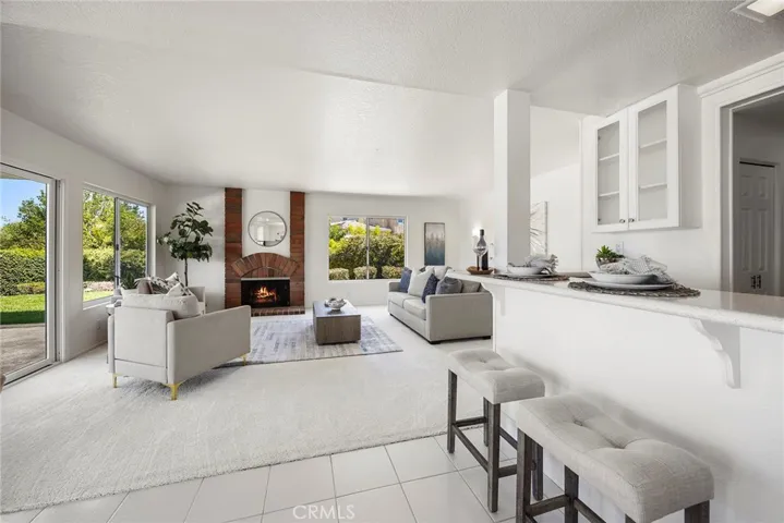 View of the family room with a gas​​‌​​​​‌​​‌‌​​‌​​​‌‌​​​‌​​‌‌​​‌‌​​‌‌​​​​ fireplace