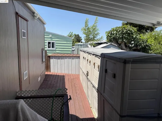 Wooden terrace with a storage shed