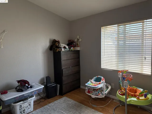 Game room featuring wood finished floors and baseboards