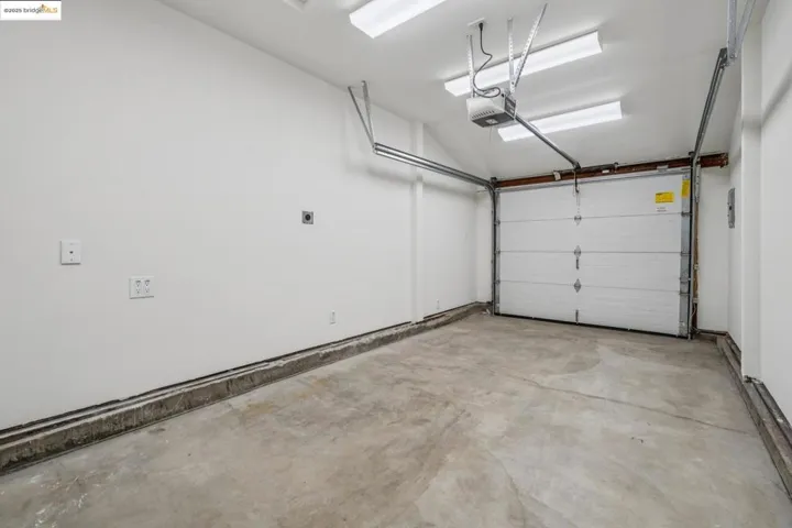 Garage featuring a garage door opener