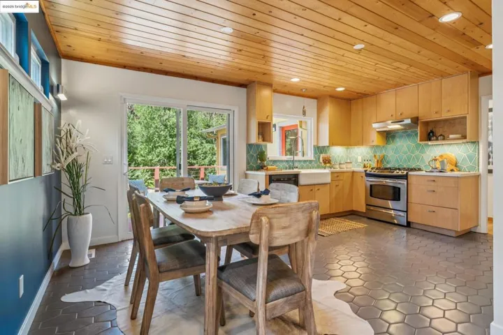 Dining area featuring wood ceiling and recessed lighting
