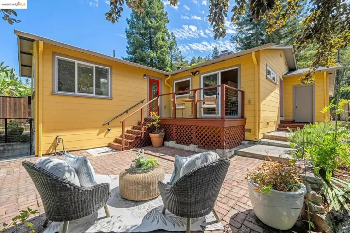 Back of house with a patio and outdoor lounge area