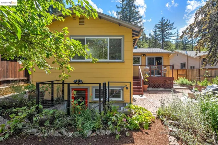 Back of property featuring a patio area and a deck