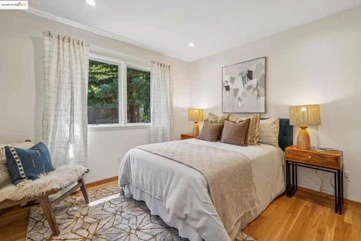 Bedroom featuring light wood-type flooring and recessed lighting