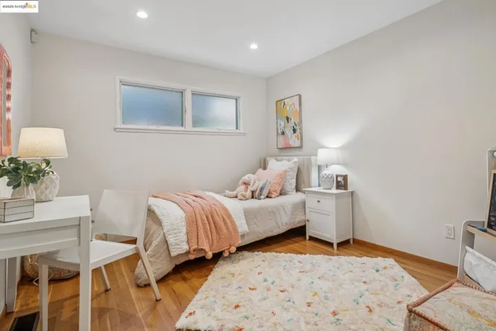 Bedroom featuring light wood-style floors and recessed lighting