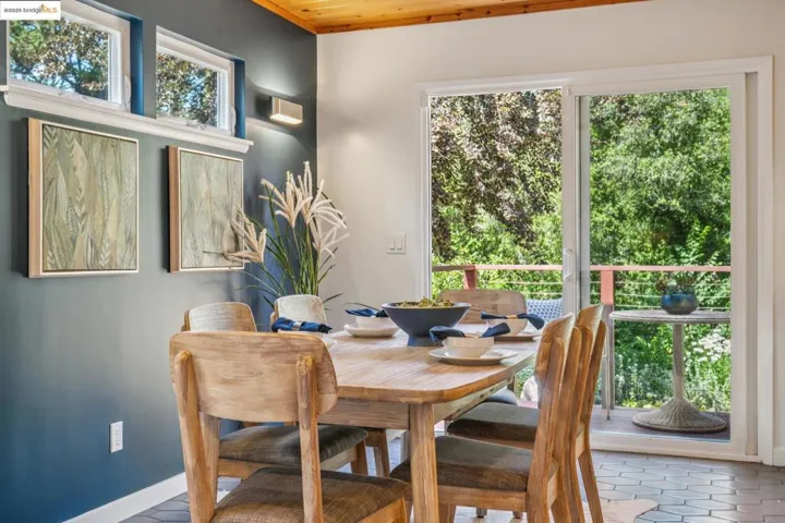 Dining space featuring baseboards and wooden ceiling