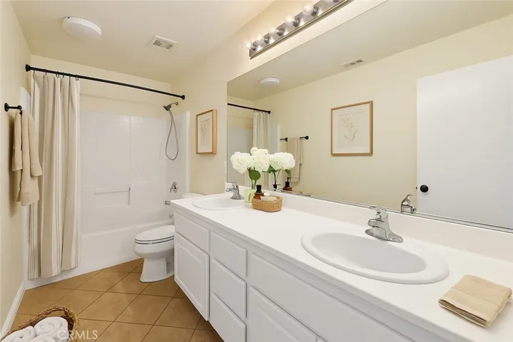 Virtually Staged Bathroom secondary upstairs. Shower/tub combo