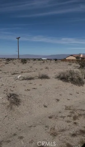 To the right side of the property is a newer built home with newer electric pole adjacent to the property.