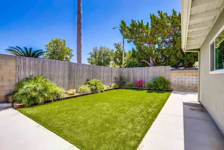 Easy lawn...artificial turf. Room for the kids and pets to play.