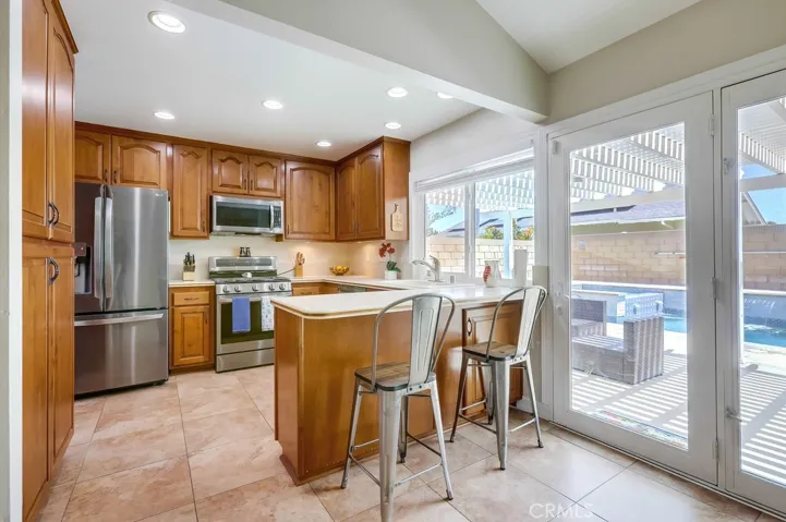 View from dining area/den into kitchen.