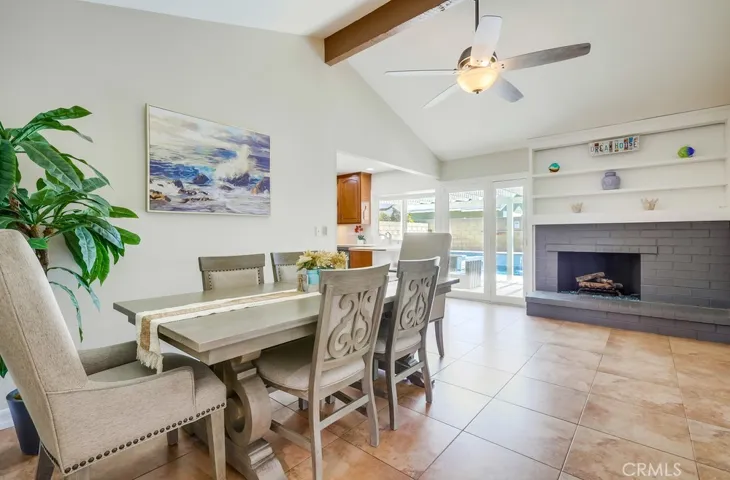 Dining area/den with cool brick fireplace.