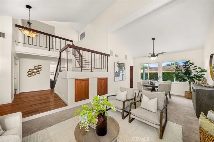 Living room and dining area. Owners had used this area as a gaming/entertaining space with a pool table and 4 monitors for gaming.