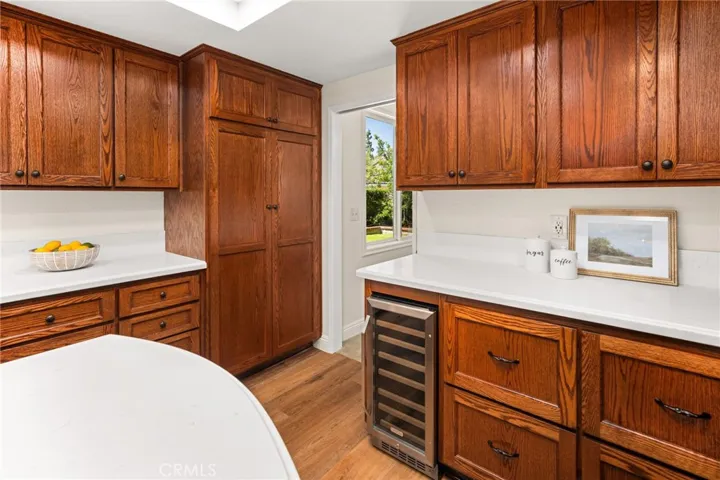 Built-in wine fridge and more storage. Access to dining/entertaining area with pocket door.