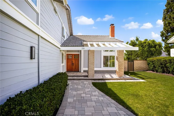 Front walkway, patio/seating area and entrance enhanced with custom pavers.