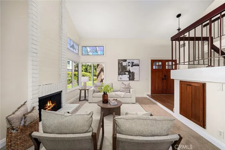 Spacious entertaining area with storage area under staircase.