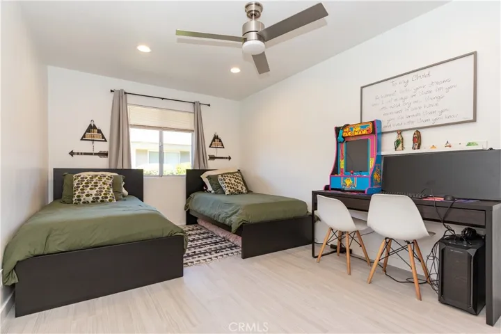 Wonderful secondary bedroom has recessed lighting and a ceiling fan, plus and ensuite bath.