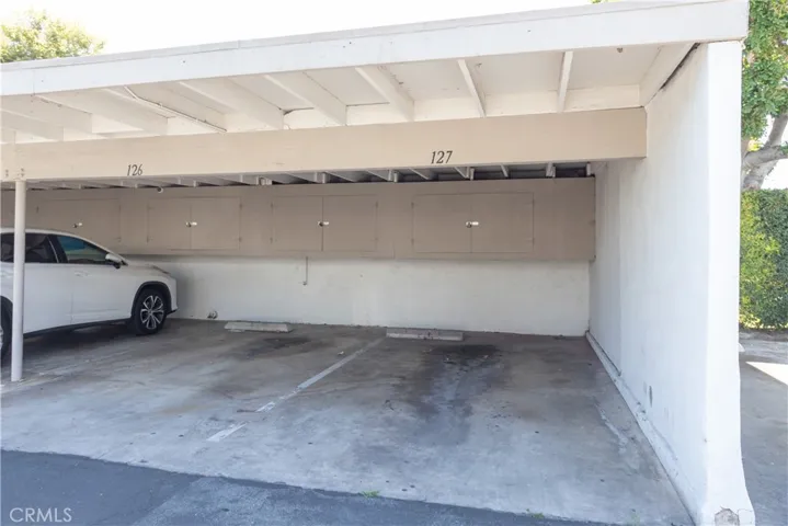 One parking space with storage is included with this property and looks like this parking area just down the sidewalk.
