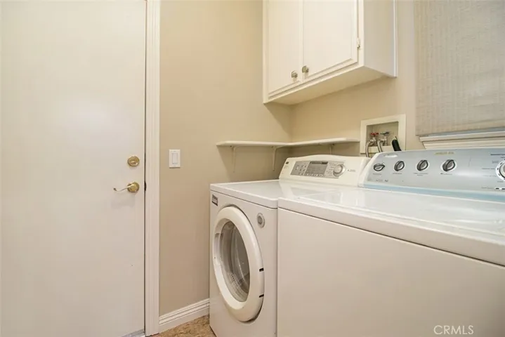 Laundry room includes washer and dryer.