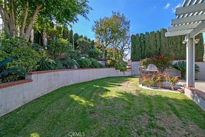 Nicely landscaped tiered terrace on slope.